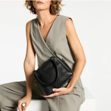 Black Status Anxiety Mini Mountains Bag with adjustable strap, featuring a compact, stylish design perfect for everyday use.