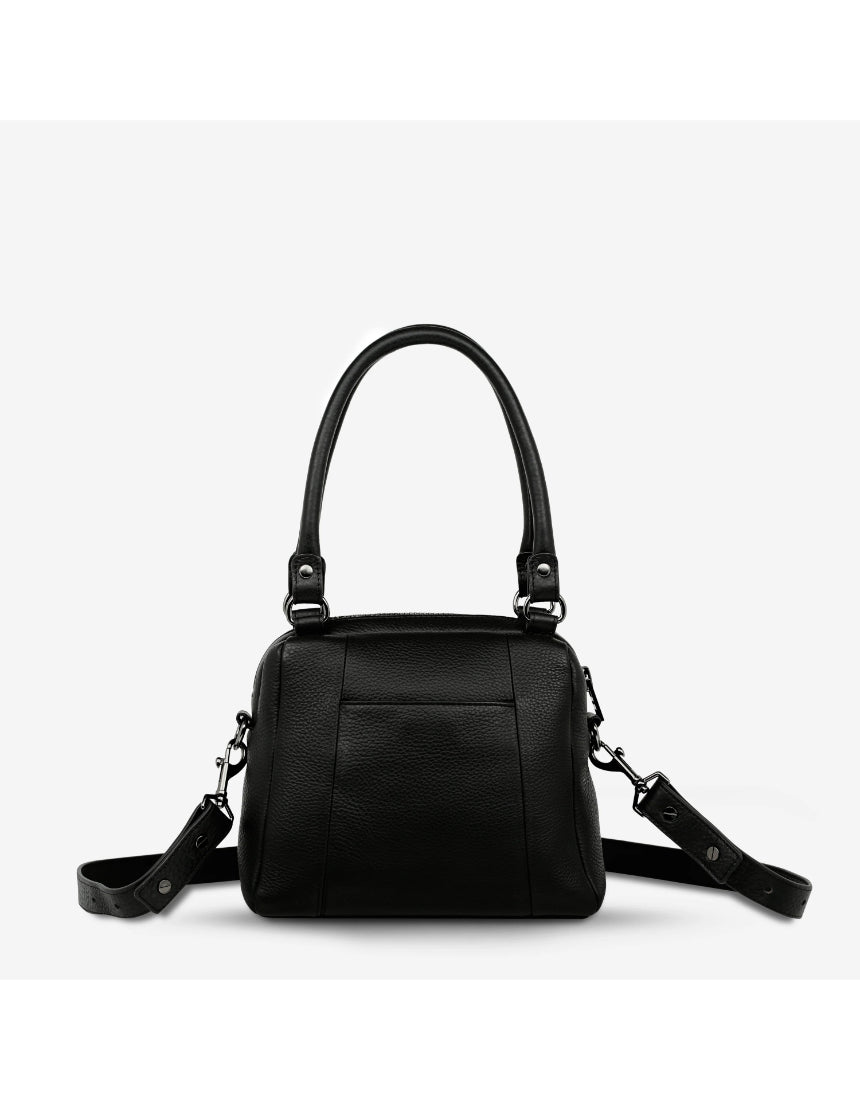 Black Status Anxiety Mini Mountains Bag with adjustable strap and minimalist mountain design on front view.