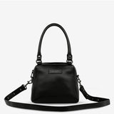 Black Status Anxiety Mini Mountains Bag with front zipper pocket and adjustable strap, stylish compact bag for everyday use.