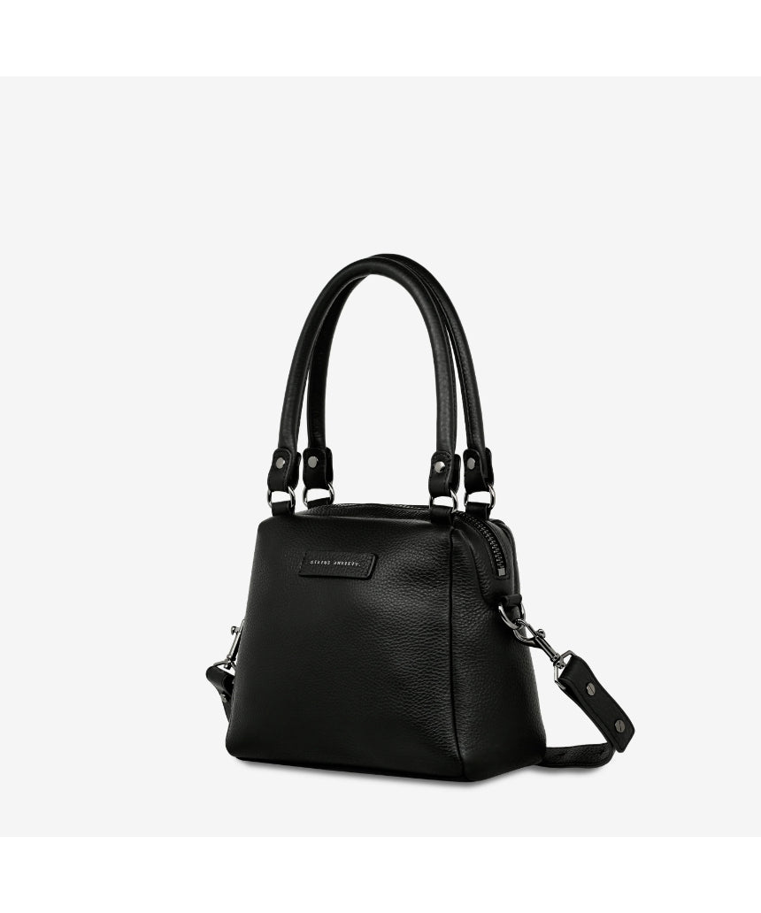 Status Anxiety Mini Mountains bag in black, showing side and front view of this stylish, compact bag with mountain-themed design.