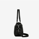 Black Status Anxiety Mini Mountains Bag with front zipper pocket and adjustable strap, stylish and compact for everyday use.
