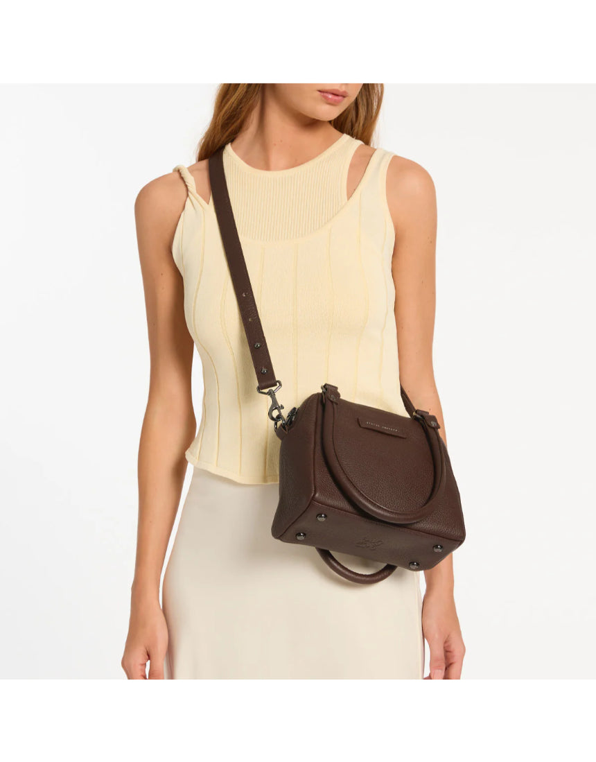 Status Anxiety Mini Mountains Bag in cocoa color with adjustable strap, stylish small bag featuring mountain-inspired design.
