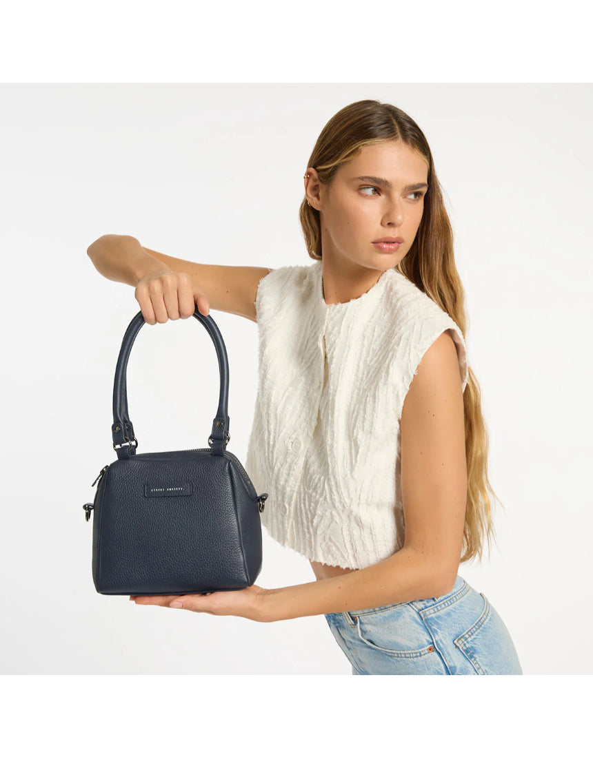 Mini Mountains bag by Status Anxiety in midnight blue, featuring a compact design with stylish, functional bag details.