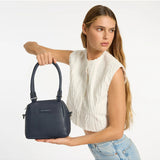 Mini Mountains bag by Status Anxiety in midnight blue, featuring a compact design with stylish, functional bag details.