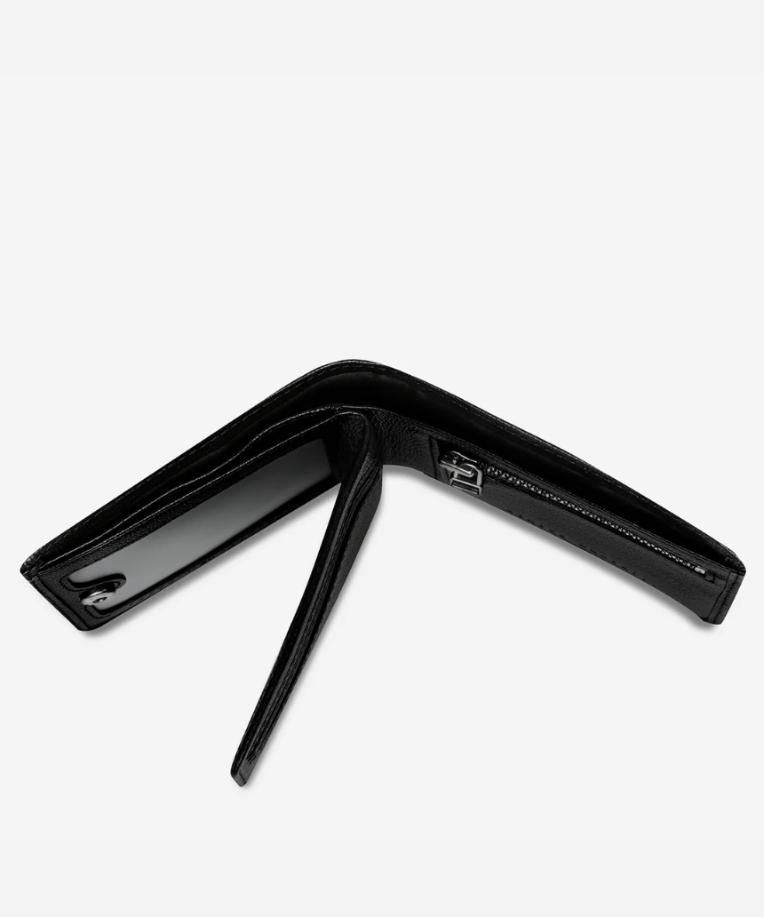 Black Status Anxiety Leonard Wallet with sleek leather design, featuring multiple card slots and a compact, stylish look.