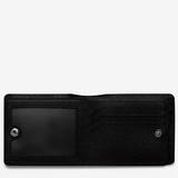 Black Leonard Wallet by Status Anxiety, a stylish leather wallet with multiple card slots and a sleek design.