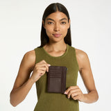 Status Anxiety Gone Again Wallet in Cocoa Nappa leather showing front view with multiple card slots and sleek design.