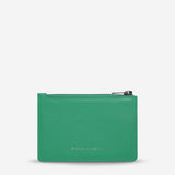 Status Anxiety Gone Again Wallet in Emerald Nappa leather, front view showing sleek design and vibrant green color.
