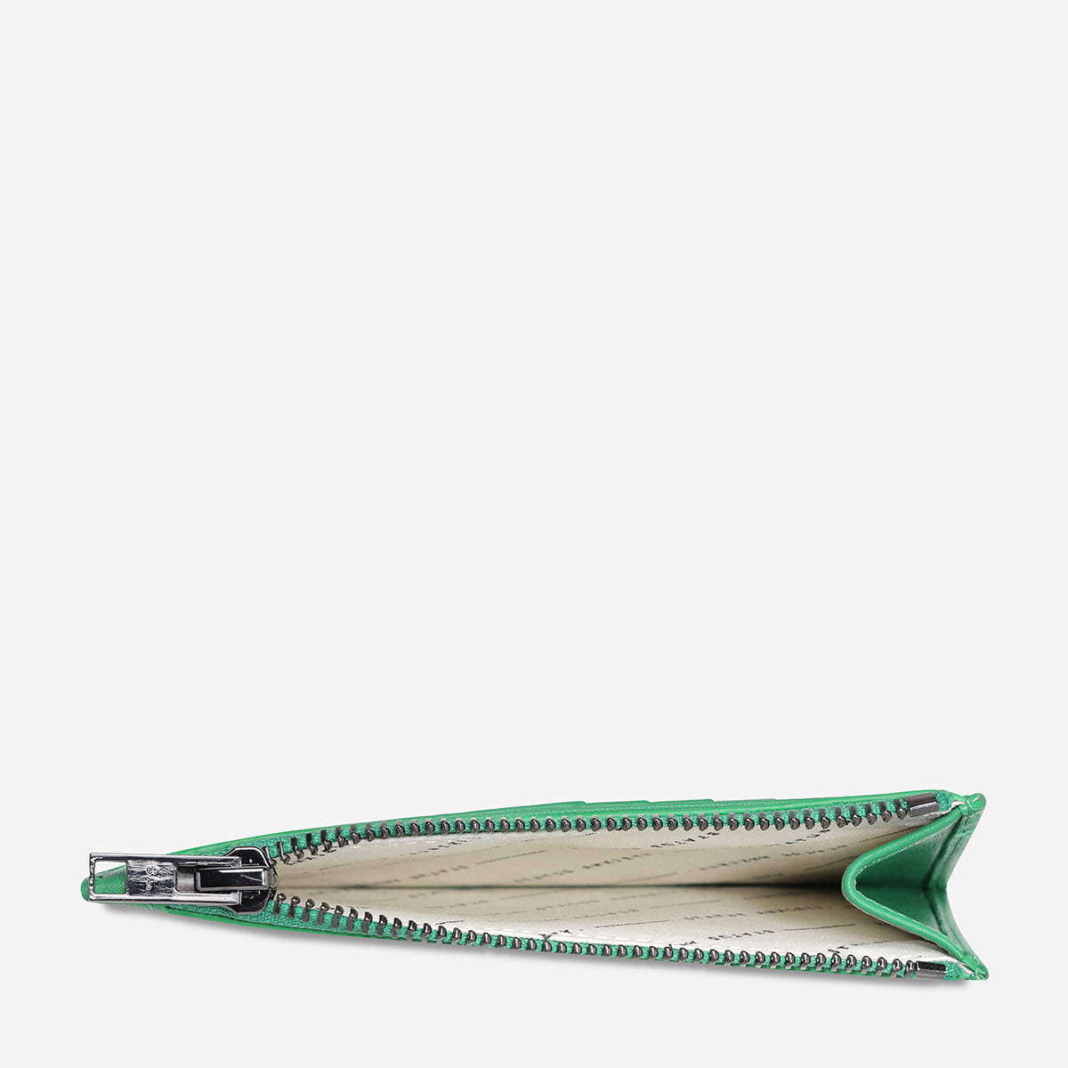 Status Anxiety Gone Again Wallet in emerald Nappa leather, open to show multiple card slots and sleek design.
