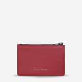 Status Anxiety Gone Again Wallet in Rouge Nappa leather, front view showcasing compact design and rich red color.