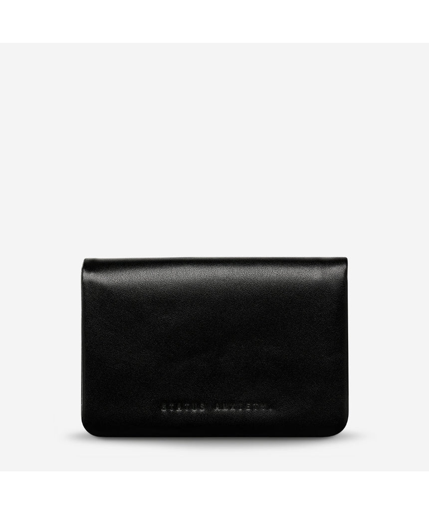 Black Status Anxiety Is Now Better Wallet with smooth leather front, compact design, and multiple card slots.