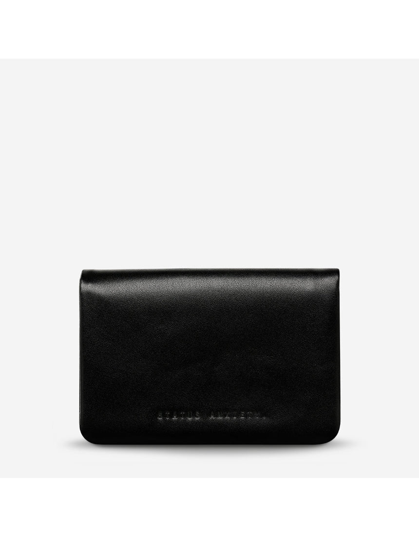 Black Status Anxiety Is Now Better Wallet with smooth leather front, compact design, and multiple card slots.