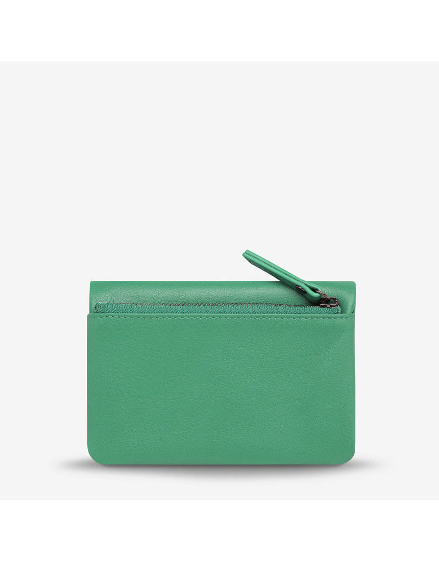 Status Anxiety Is Now Better Wallet with smooth emerald green leather and sleek design, perfect for organizing cards and cash.