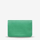 Status Anxiety Is Now Better Wallet in emerald with smooth front, featuring a sleek, modern design for everyday use.