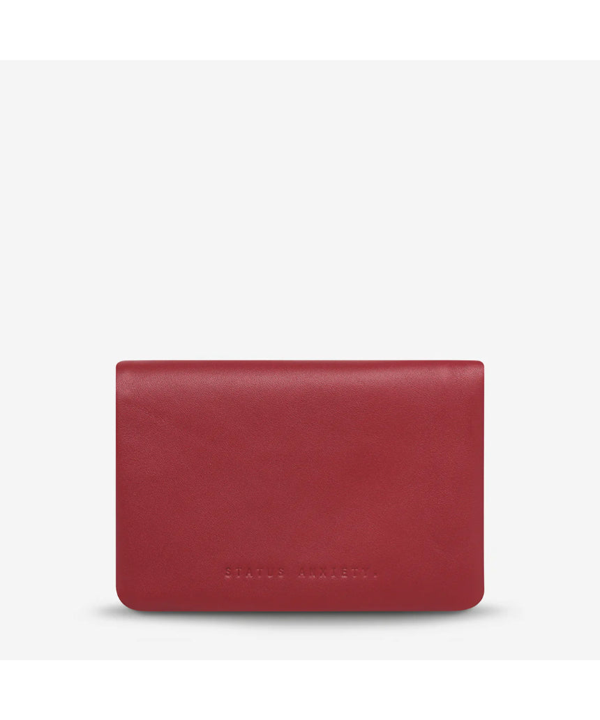 Status Anxiety Is Now Better Wallet in Rouge, smooth leather front with multiple card slots and sleek design.