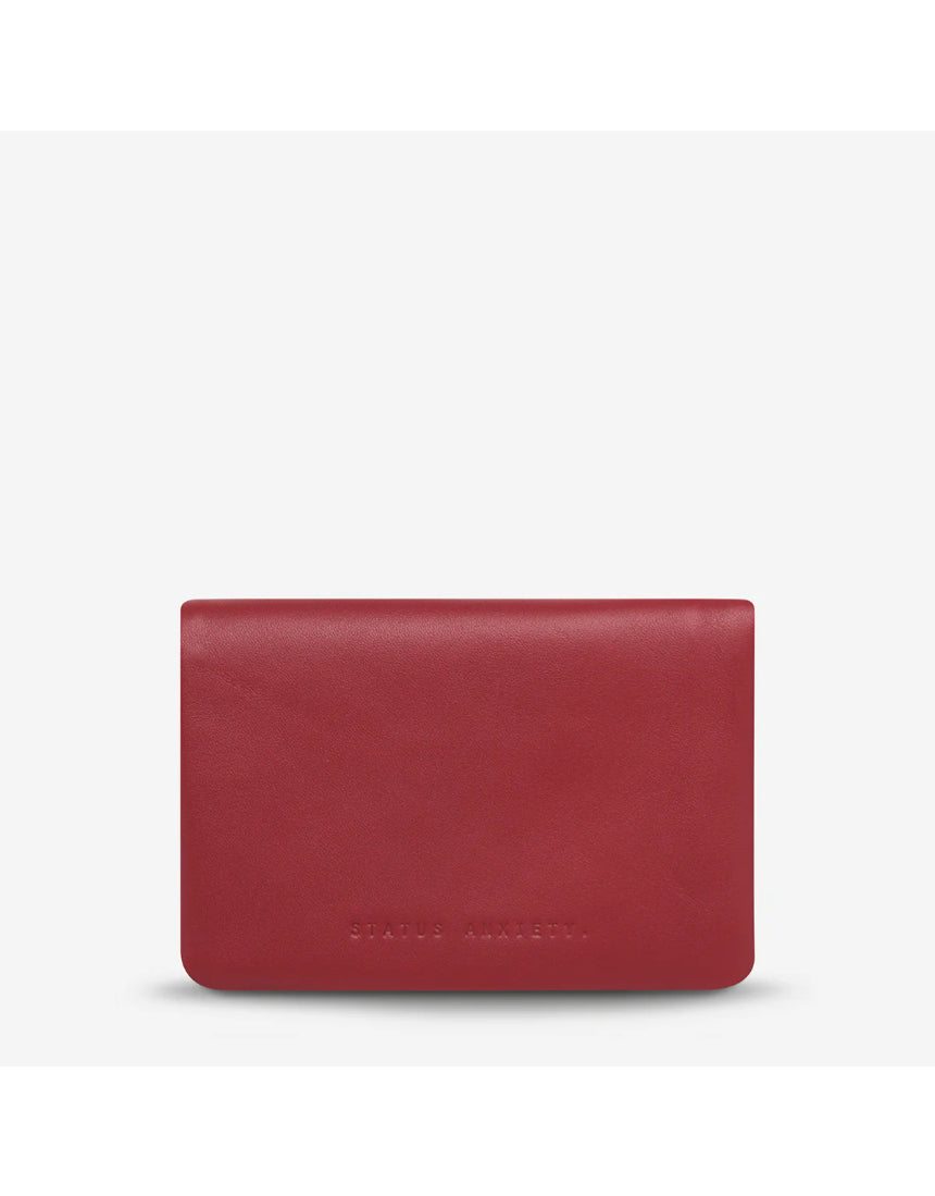 Status Anxiety Is Now Better Wallet in Rouge, smooth leather front with multiple card slots and sleek design.
