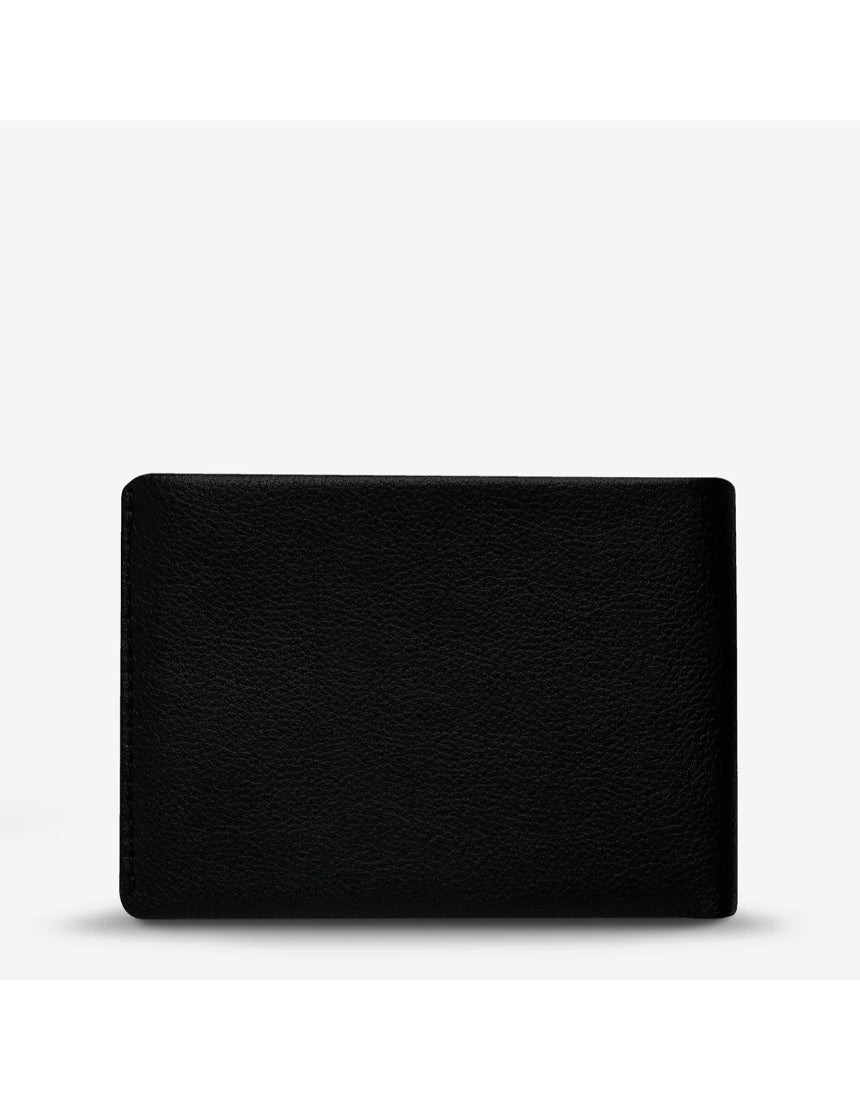 Black Status Anxiety Jonah Wallet with multiple card slots and a sleek design, shown from the back view.