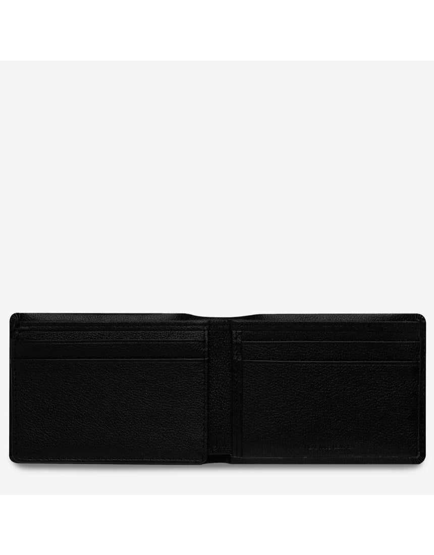 Black Status Anxiety Jonah wallet with minimalist design, featuring a smooth leather finish and compact structure for everyday use.