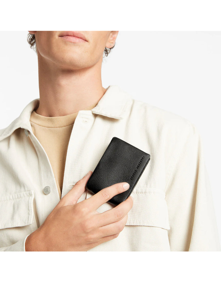 Black Status Anxiety Jonah Wallet with multiple card slots and wallet compartments, made from genuine leather.