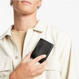 Black Status Anxiety Jonah Wallet with multiple card slots and wallet compartments, made from genuine leather.