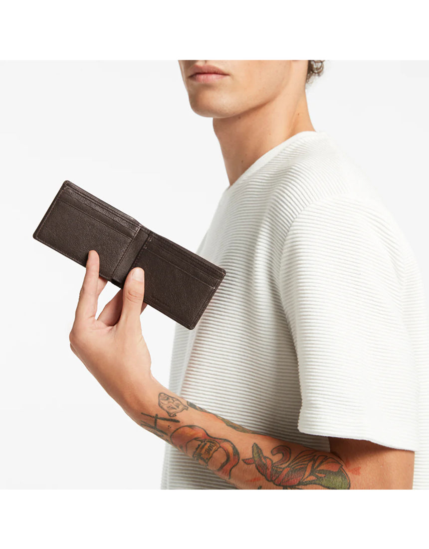 Status Anxiety Jonah Wallet in chocolate color, featuring multiple card slots and sleek design for everyday use.