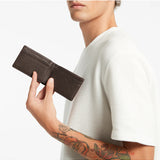 Status Anxiety Jonah Wallet in chocolate color, featuring multiple card slots and sleek design for everyday use.