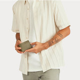 Status Anxiety Jonah Wallet in khaki, a compact leather wallet with multiple card slots and a sleek design.