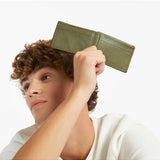 Status Anxiety Jonah Wallet in khaki, stylish leather wallet with multiple card slots and a sleek design.