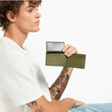 Khaki Status Anxiety Jonah Wallet with multiple card slots and compact design, featuring the brand's signature style.