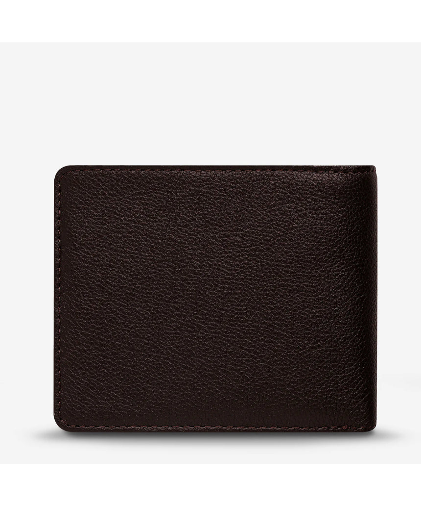 Status Anxiety Leonard Wallet in chocolate brown with multiple card slots and a sleek leather design.