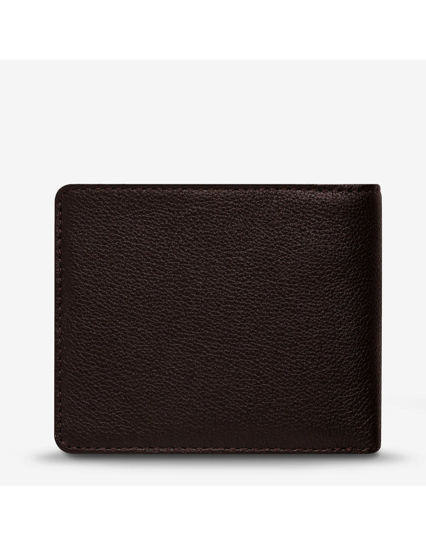 Status Anxiety Leonard Wallet in chocolate brown with multiple card slots and a sleek leather design.