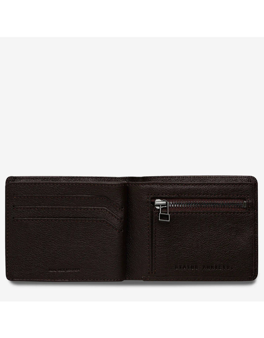 Status Anxiety Leonard Wallet in chocolate brown with multiple card slots and a sleek design, shown open to reveal interior compartments.