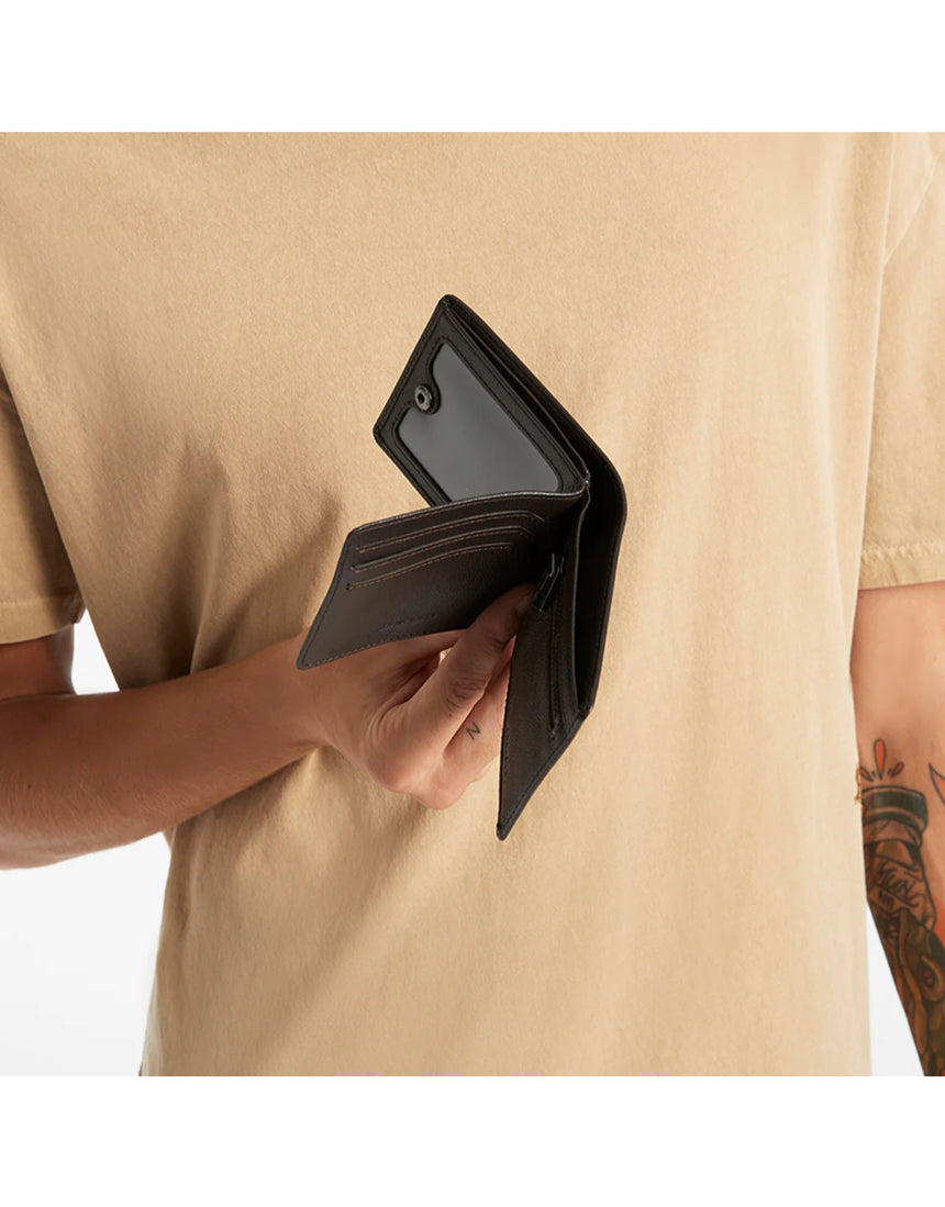 Status Anxiety Leonard Wallet in chocolate brown, featuring card slots and a sleek leather design.