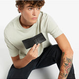 Black Status Anxiety Otis Wallet with multiple card slots and sleek leather design for everyday use.