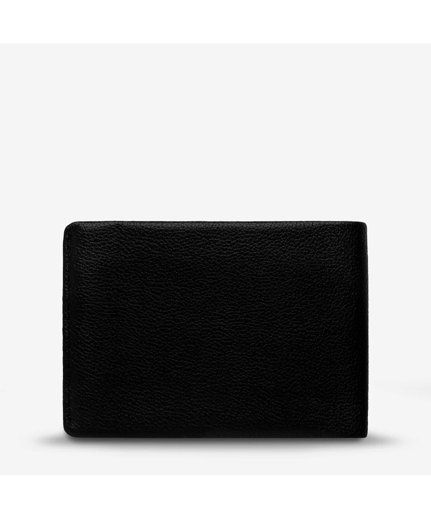Status Anxiety Otis Wallet in black showing front view with card slots and sleek leather design.