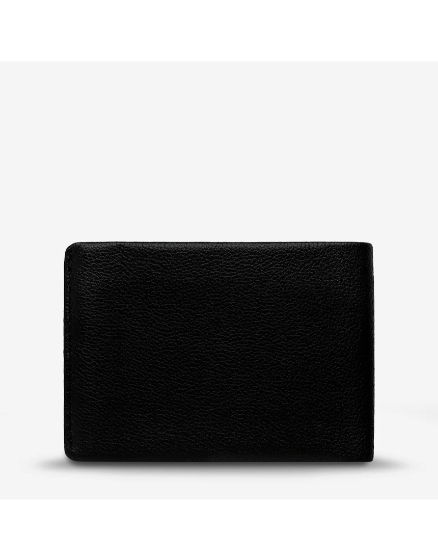 Status Anxiety Otis Wallet in black showing front view with card slots and sleek leather design.