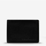 Black Status Anxiety Otis Wallet with multiple card slots and compact design, shown from the front view.