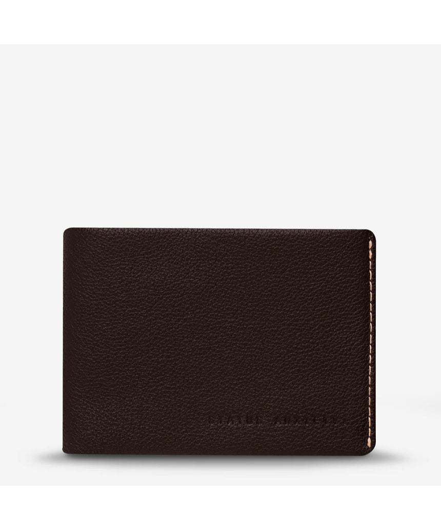 Status Anxiety Otis Wallet in chocolate brown, compact leather wallet with multiple card slots and a minimalist design.