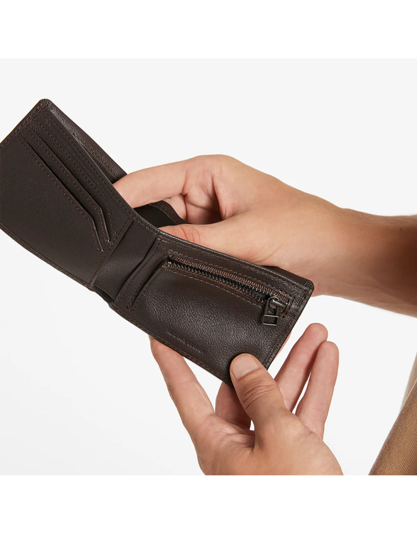 Status Anxiety Otis Wallet in chocolate, a stylish leather wallet with multiple card slots and a sleek design.