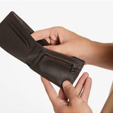 Status Anxiety Otis Wallet in chocolate, a stylish leather wallet with multiple card slots and a sleek design.