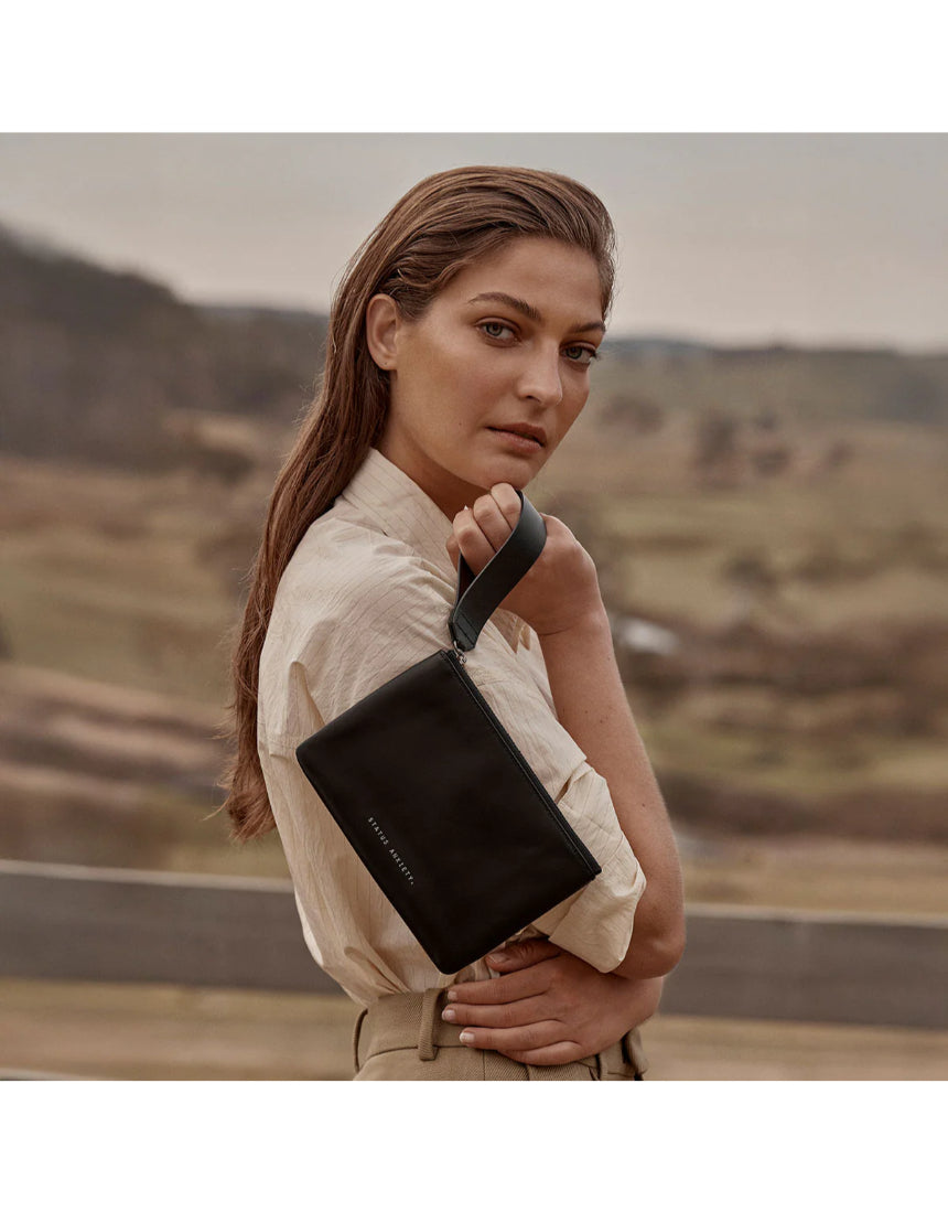 Black Status Anxiety Take Your Chances wallet with multiple card slots and a sleek, minimalist design.