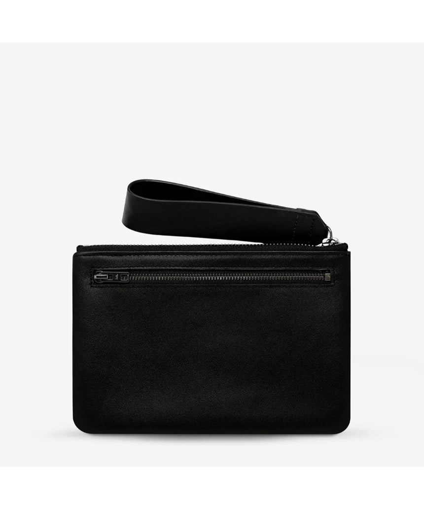 Black Status Anxiety Take Your Chances wallet with smooth leather finish, featuring multiple card slots and a sleek, minimalist design.