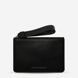 Black Status Anxiety Take Your Chances wallet with smooth leather finish, featuring multiple card slots and a sleek design.