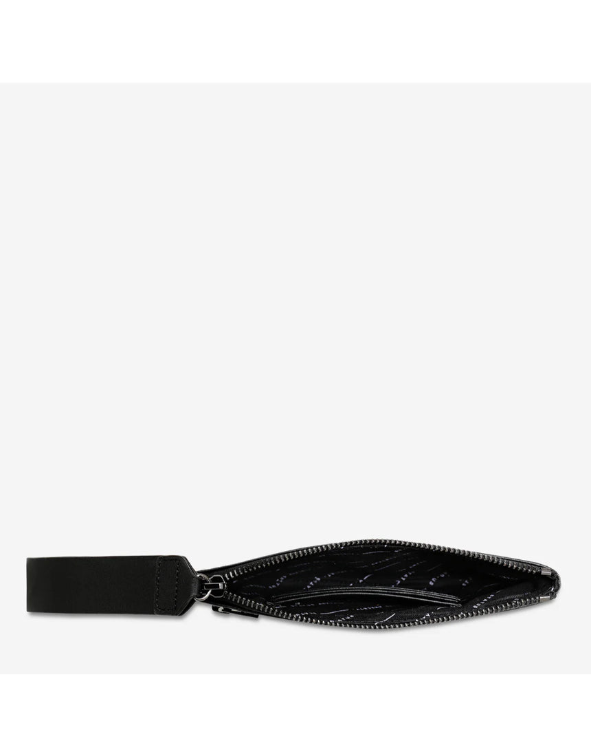 Open black Status Anxiety Take Your Chances wallet with multiple card slots and a smooth leather finish.