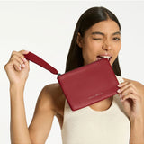 Status Anxiety Take Your Chances Wallet in rouge color, featuring a compact leather design with multiple card slots and a sleek finish.
