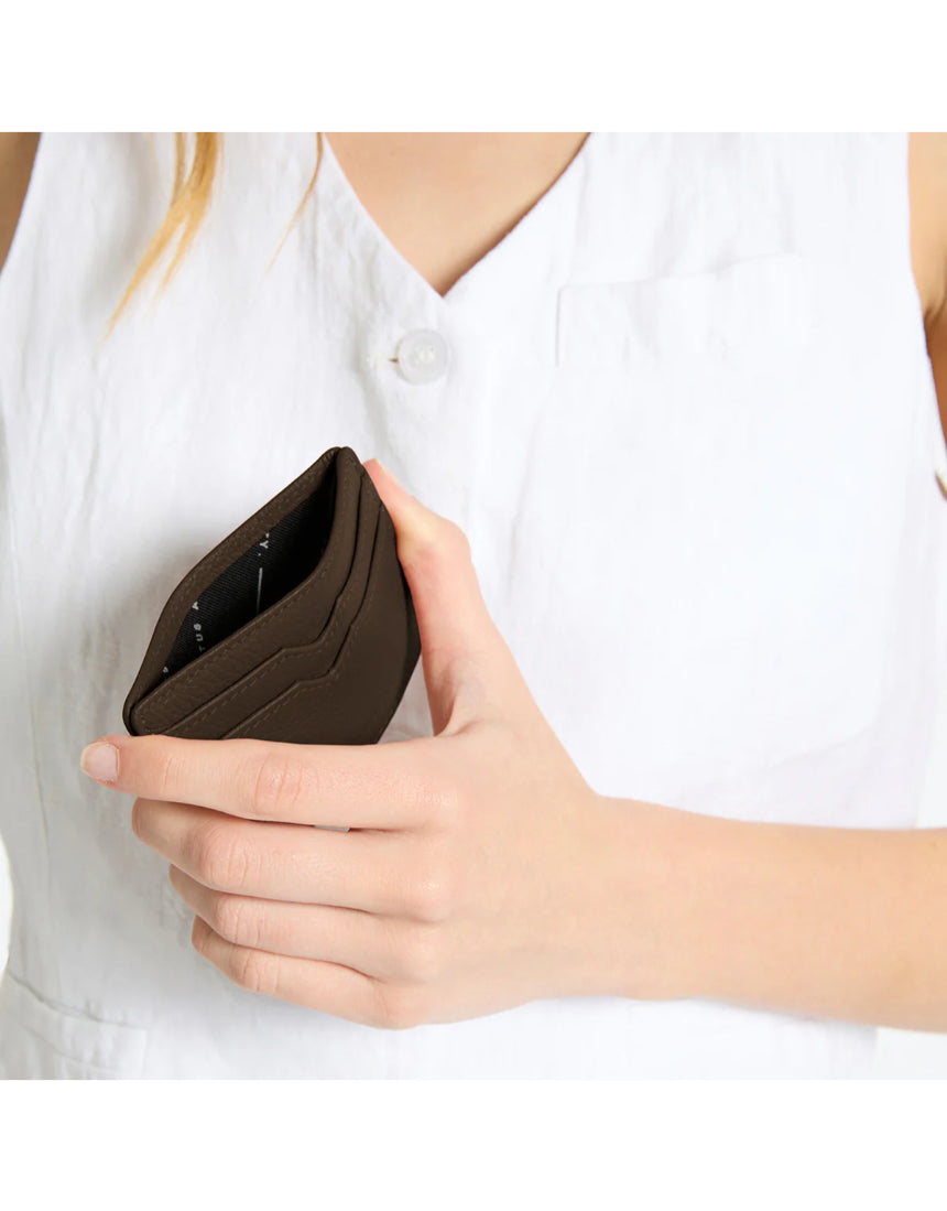Status Anxiety Together For Now Cocoa wallet featuring a sleek leather design, shown open with card slots and stylish craftsmanship.