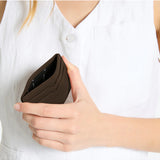 Status Anxiety Together For Now Cocoa wallet featuring a sleek leather design, shown open with card slots and stylish craftsmanship.