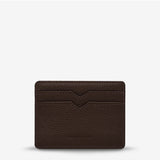 Status Anxiety Together For Now Cocoa wallet, made of leather, showing the back with stitched design and brand logo.