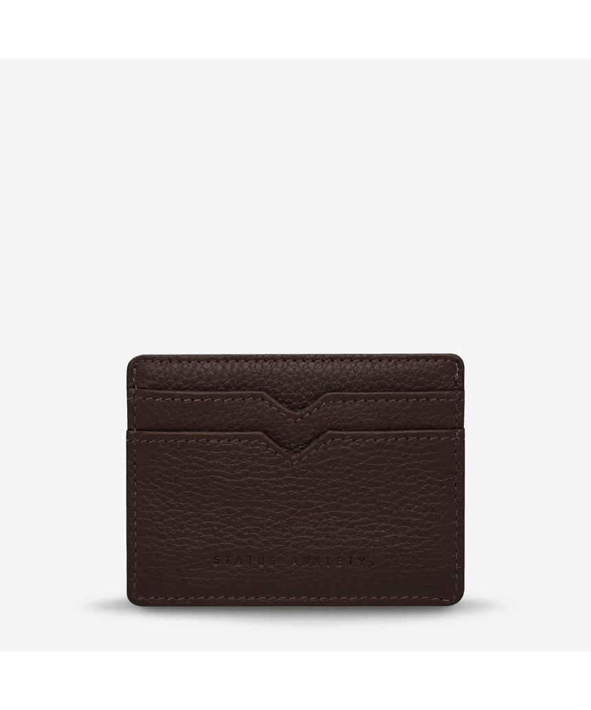 Status Anxiety Together For Now Cocoa wallet, a stylish leather accessory with a front view showing its textured surface and compact design.