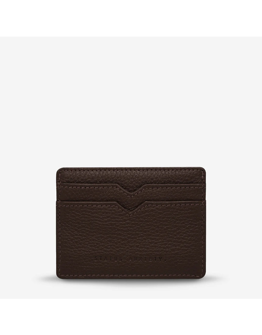 Status Anxiety Together For Now Cocoa wallet, a stylish leather accessory with a front view showing its textured surface and compact design.